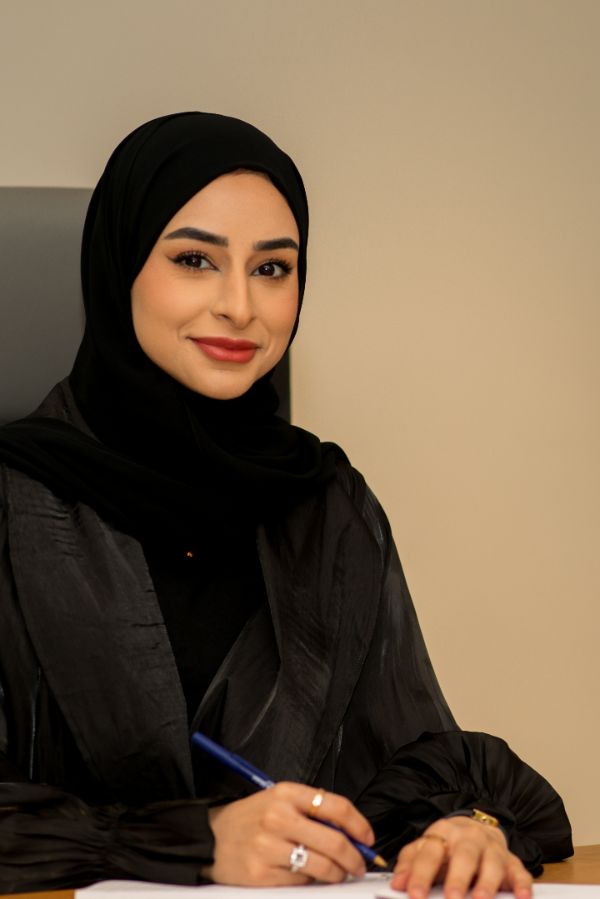 Latifa Bin Haider working at her desk in Dubai